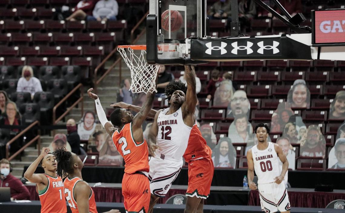 South Carolina Gamecocks guard Trae Hannibal (12) shoots as Florida A&M Rattlers guard Kamron Reaves (2) tries to block on January, 2, 2021.