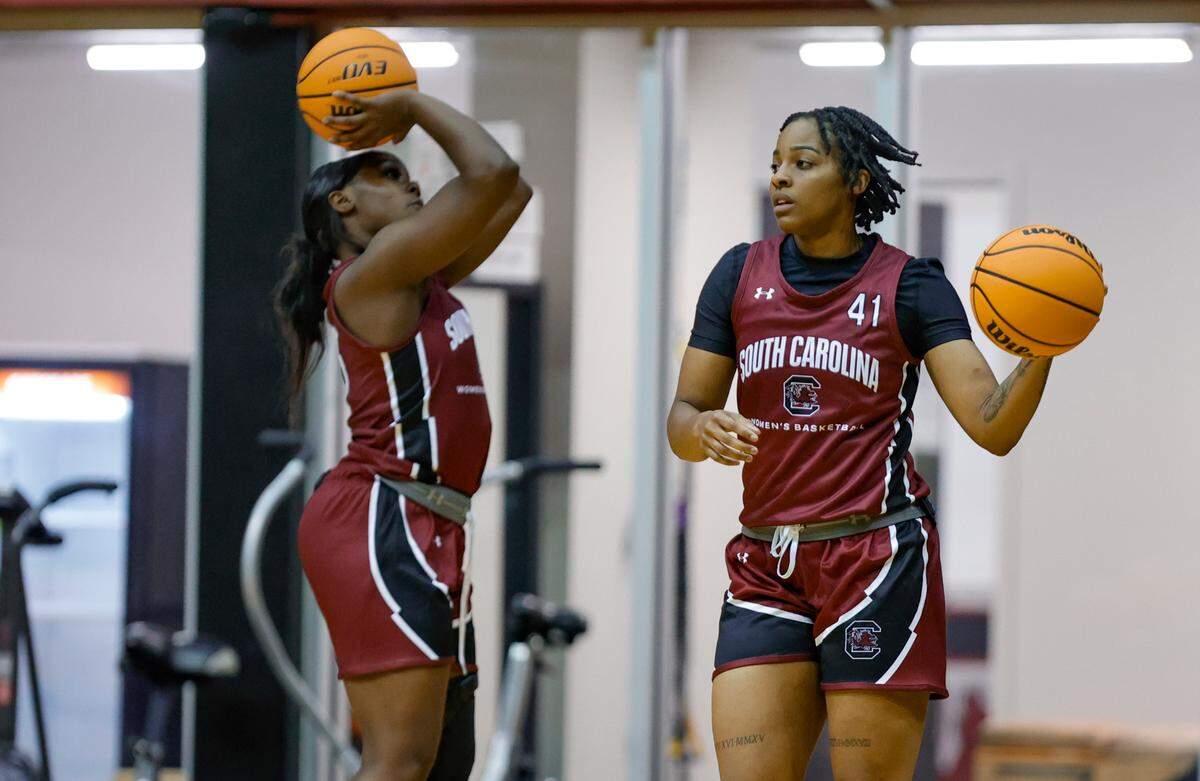 Raven Johnson (25) and Kierra Fletcher (41) shoot the ball as the Gamecocks hold their first team practice in the Carolina Coliseum on Wednesday, Sept. 28, 2022.