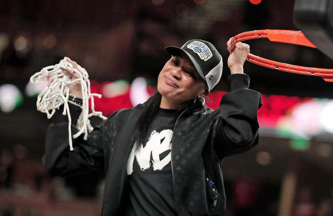 South Carolina’s Dawn Staley celebrates Sunday’s SEC tournament championship win at Bon Secours Wellness Arena in Greenville.