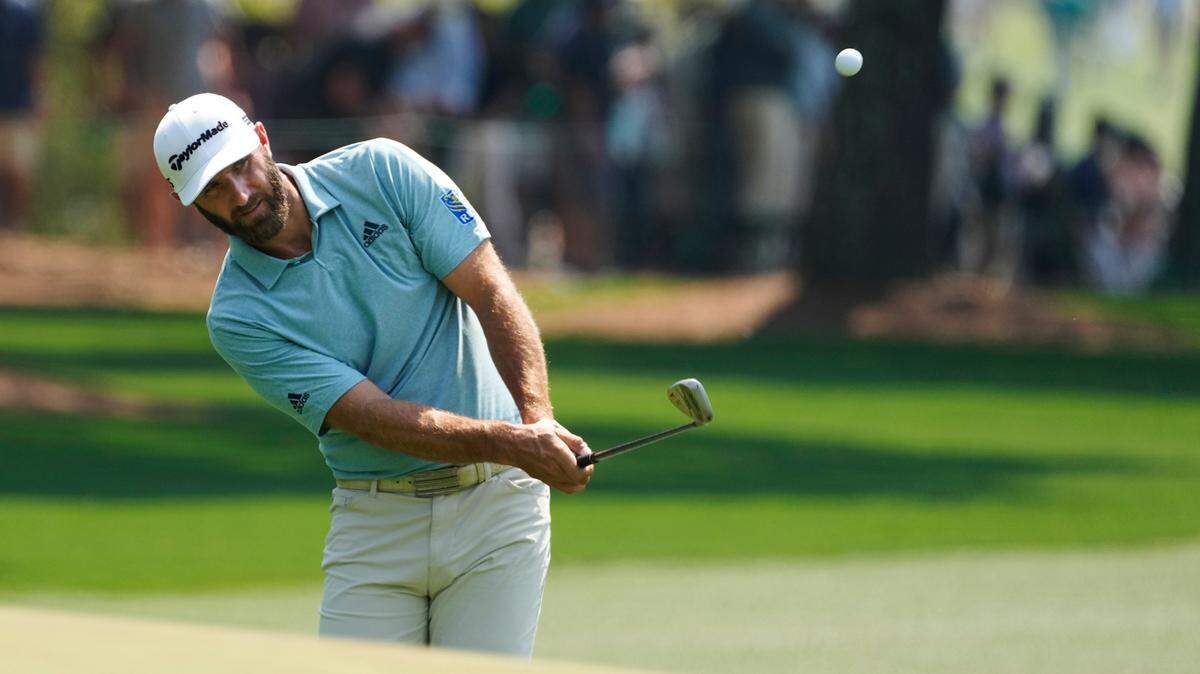 Dustin Johnson hits to the first green during a practice round for the Masters golf tournament on Wednesday, April 7, 2021, in Augusta, Ga. (AP Photo/Charlie Riedel)