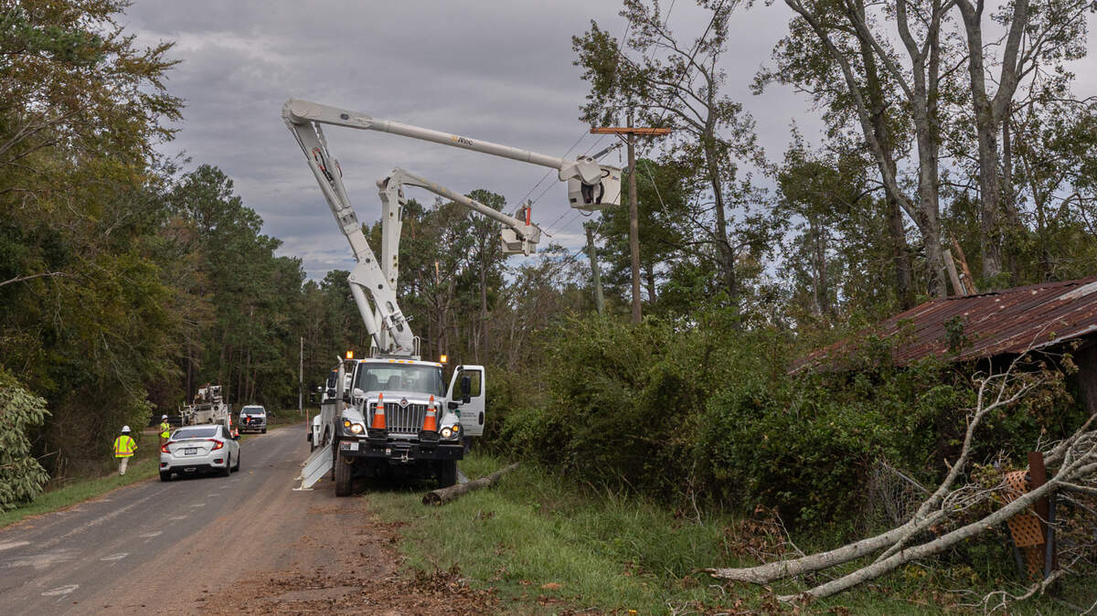 Utility crews with Aiken Electric Cooperative, repair downed power lines on Lanham Road in Edgefield on Tuesday, Oct. 1, 2024. High winds from Hurricane Helene toppled trees leaving thousands without power. The damage to rural areas is so bad that along many roads, the entire electrical infrastructure needs to be rebuilt.