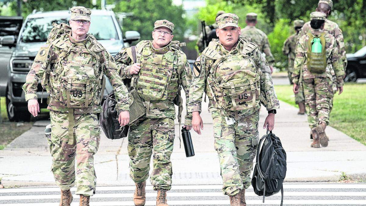 Members of the National Guard arrive at the D.C. Armory in Washington on August 12, 2025.