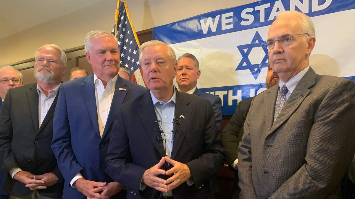 Surrounded by preachers, U.S. Sen. Lindsey Graham (center) speaks to the media Oct. 13, 2023 about the war between Israel and Hamas. Graham was in Columbia, S.C. meeting with evangelical leaders.