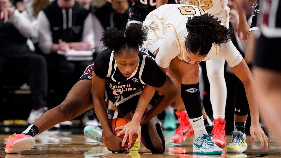 South Carolina forward Joyce Edwards (8) and Vanderbilt forward Khamil Pierre (12) scramble for a loose ball during the first quarter at Memorial Gym in Nashville, Tenn., Sunday, Feb. 23, 2025.