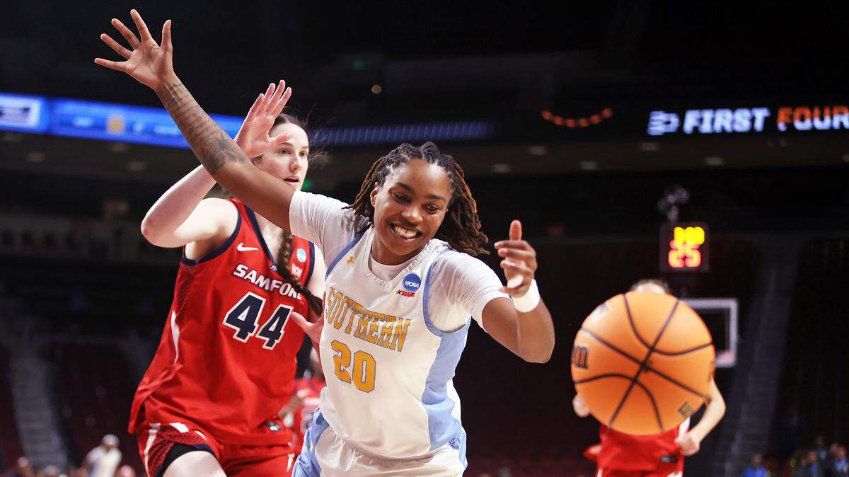 Southern’s Zaria Hurston (20) loses the ball out of bounds while being defended by Samford’s Emily Snoddy (44) during their NCAA Tournament First Four game Thursday at Colonial Life Arena.