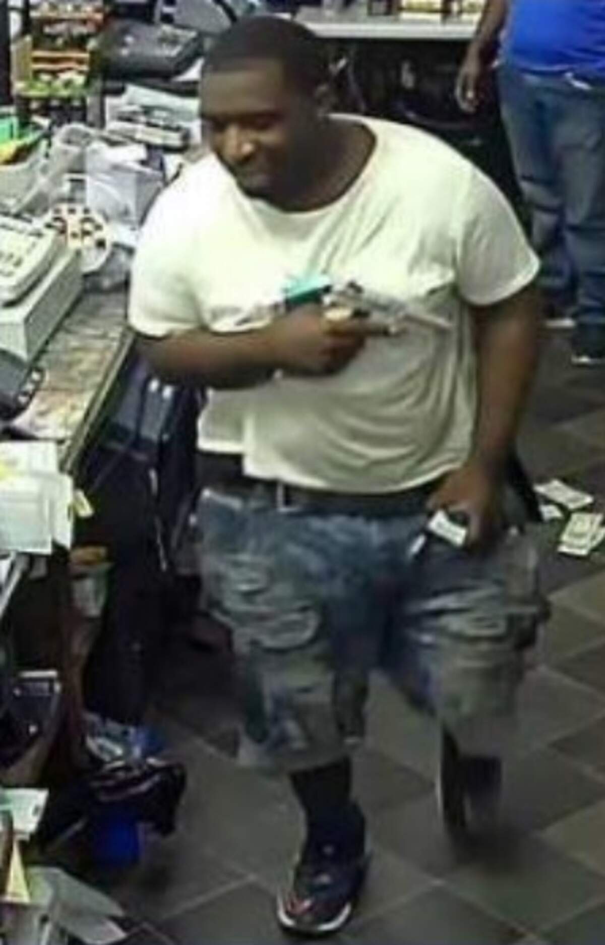 Surveillance footage of a suspect robbing a Two Notch Road gas station store.