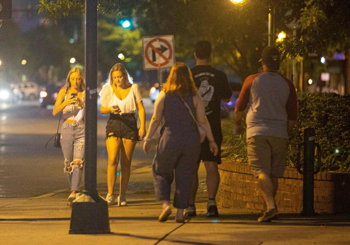 Five Points on Friday, June 26, 2020. While the city ordinance does not require people to wear masks outdoors if they are far apart from one another, most people The State journalists saw Friday night were wearing masks while walking around.