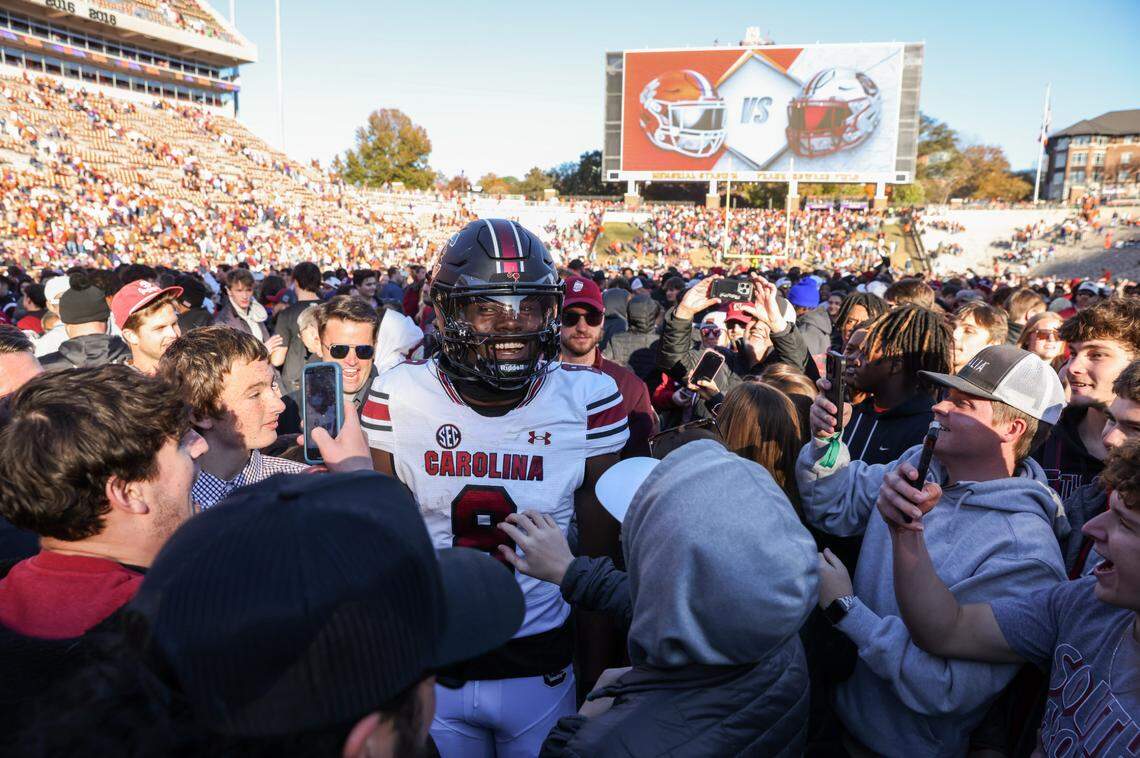 South Carolina wide receiver Nyck Harbor (8) celebrates with fans after defeating Clemson in the Palmetto Bowl between at Memorial Stadium in Clemson on Saturday, November 30, 2024.