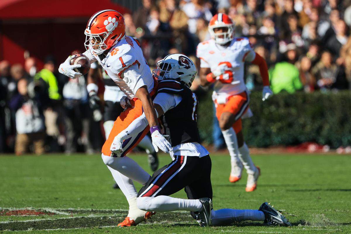 South Carolina cornerback Brandon Cisse (15) takes down Clemson wide receiver T.J. Moore (1) at Williams-Brice Stadium on Saturday, November 29, 2025.