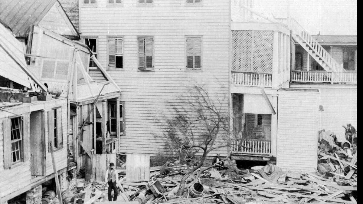 An unidentified man stands amid wreckage from the August 1893 Sea Islands Hurricane that left 30,000 men, women and children homeless on the barrier islands of South Carolina and Georgia. Clara Barton set up headquarters in
an old warehouse in Beaufort and remained to oversee the aid effort for nine months.