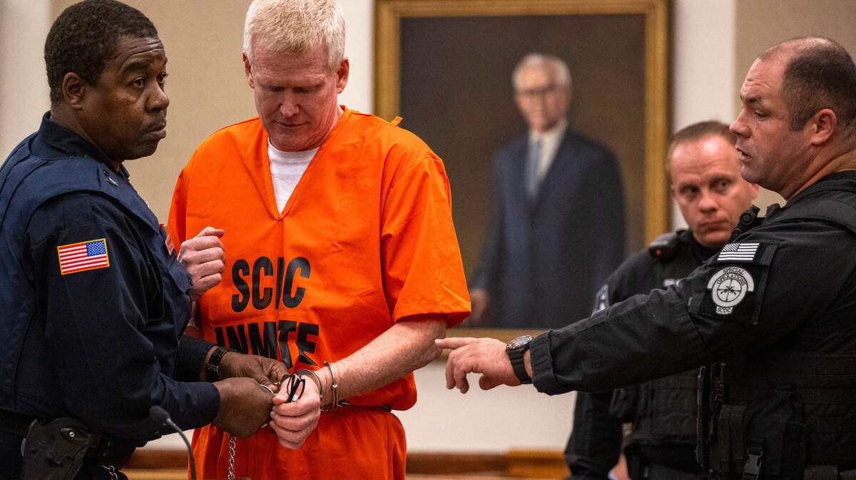 Alex Murdaugh’s handcuffs are removed as he prepares to address the court during his sentencing for his financial crimes in the Beaufort County Courthouse on Nov. 28, 2023.