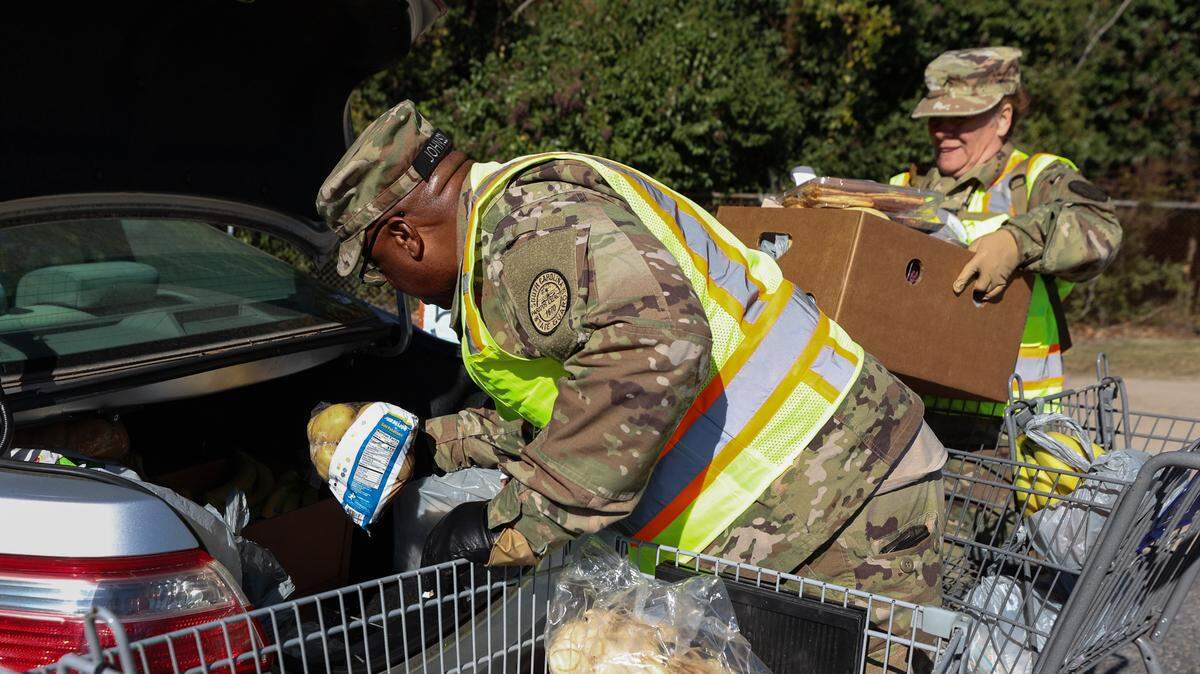 Members of the South Carolina State Guard, including Lt. Allen Johnson and Pvt. Tonia Brown-Epling , help load food on Wednesday, Nov. 5, 2025, at the Harvest Hope Food Bank in Columbia. Since the federal government shut-down, which eliminated SNAP benefits, the food bank has nearly doubled their daily distribution.