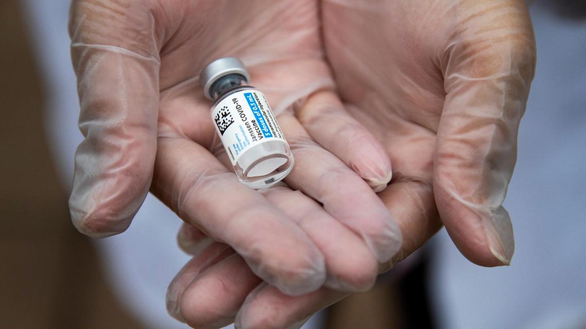 Dr. Dhruti Patel holds a vial of the Janssen COVID-19 vaccine at Lexington Pharmacy on Thursday, March 18, 2021. The pharmacy is administering the Johnson & Johnson coronavirus vaccine, which is one shot as opposed to the two shot vaccines made by other companies.