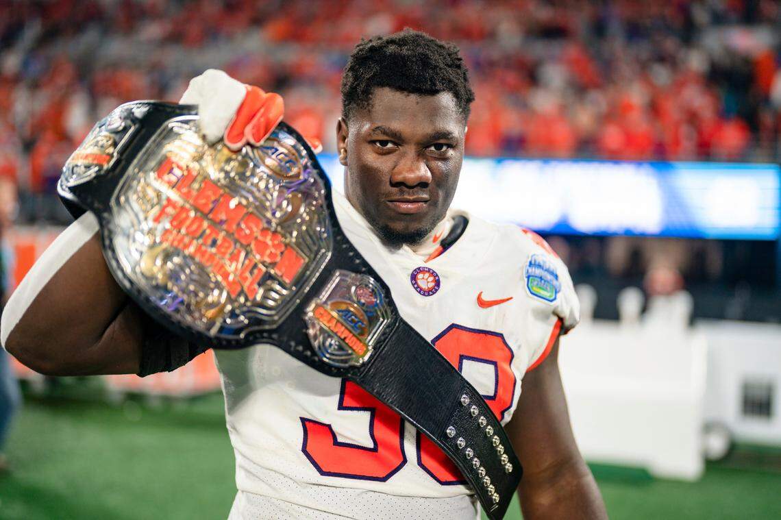 Clemson defensive tackle Ruke Orhorhoro (33) reacts after defeating North Carolina during the Atlantic Coast Conference championship NCAA college football game on Saturday, Dec. 3, 2022, in Charlotte, N.C. (AP Photo/Jacob Kupferman)
