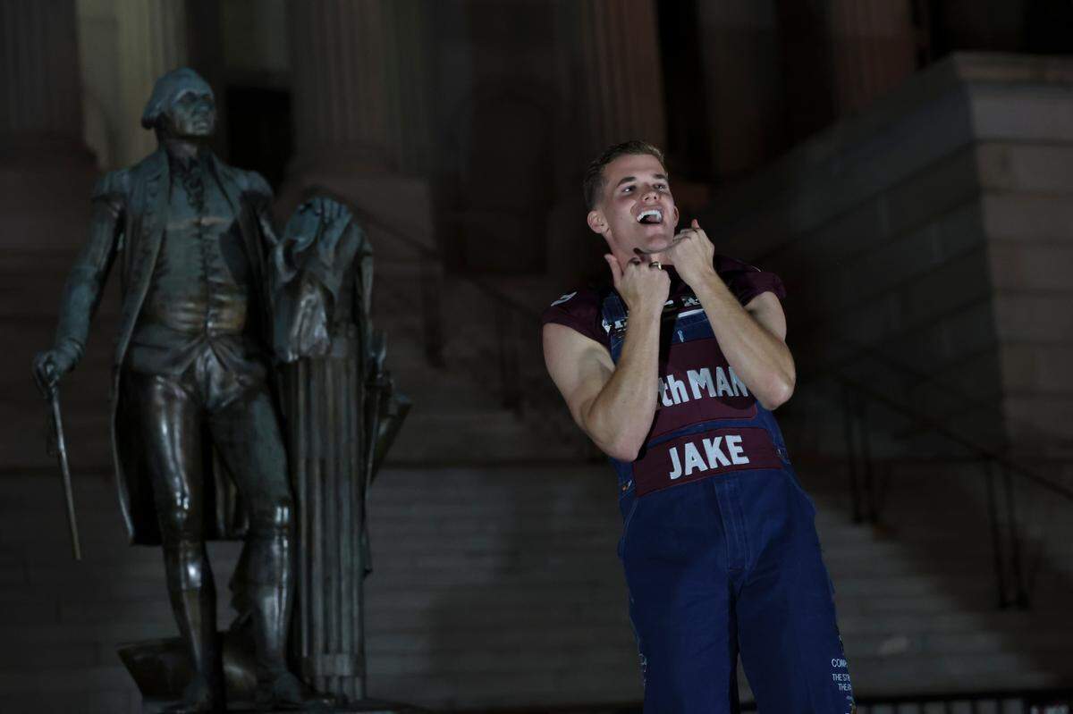 Yell leaders lead Texas A&M fans in the Aggie Yell practice in front of the South Carolina State House on Friday, Nov. 1, 2024. The Gamecocks face the Aggies Saturday at Williams-Brice Stadium.
