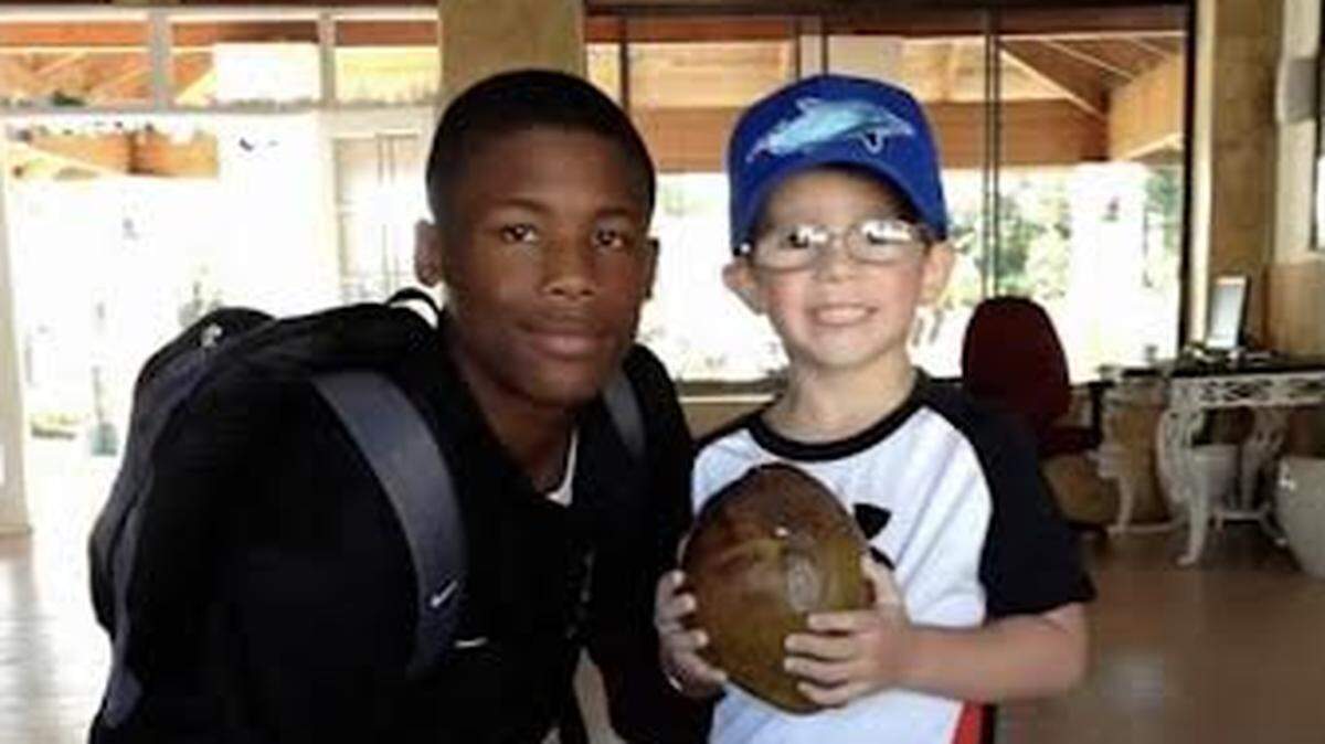 Oak Ridge guidance counselor and head girls basketball coach Paige Taylor took a photo of former Clemson wide receiver and current Bengal Tee Higgins with her son, Kutler Green, after Higgins helped Green find a coconut while in the Bahamas for a boys basketball tournament in 2013. To this day, Higgins is still Green’s hero.