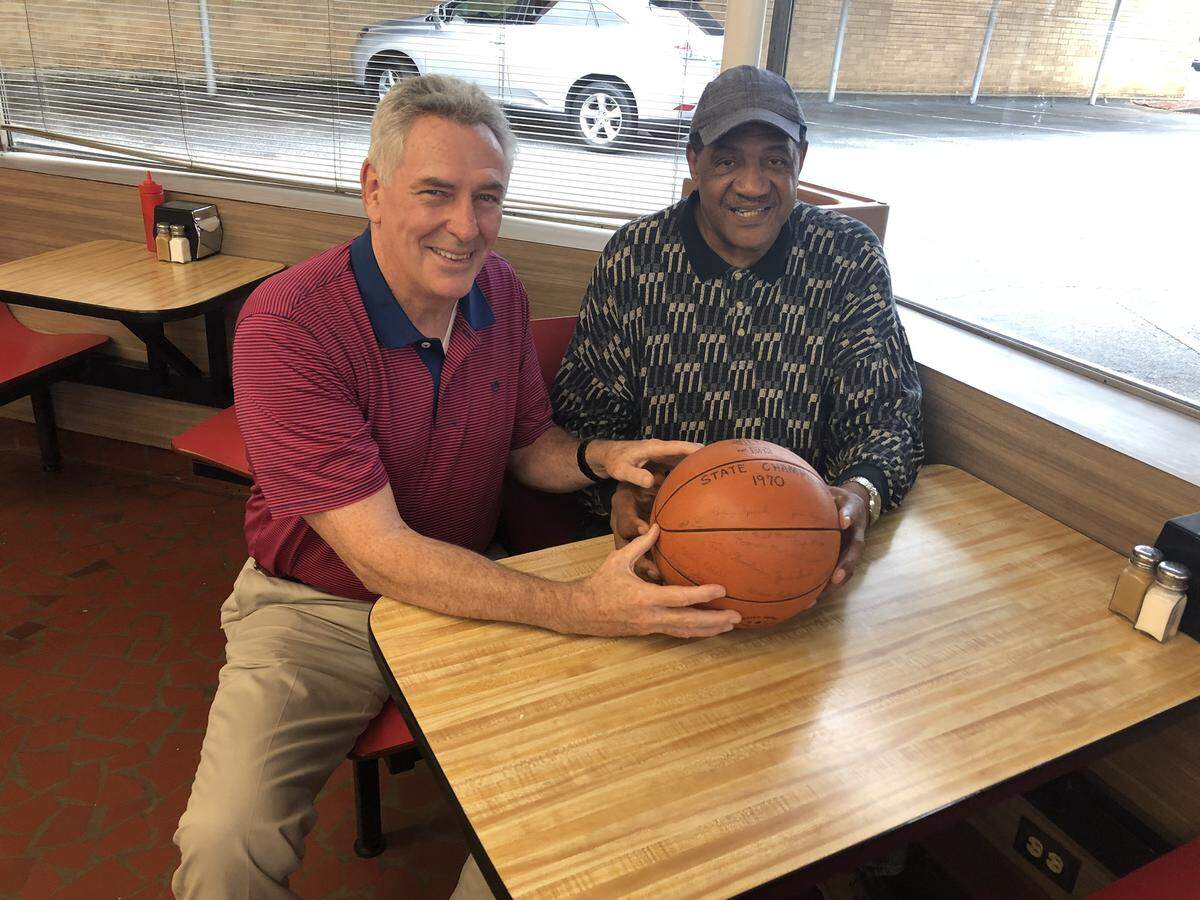 Norman MacDonald and Clyde Mayes hold the game ball from the 1970 state 4A championship game.