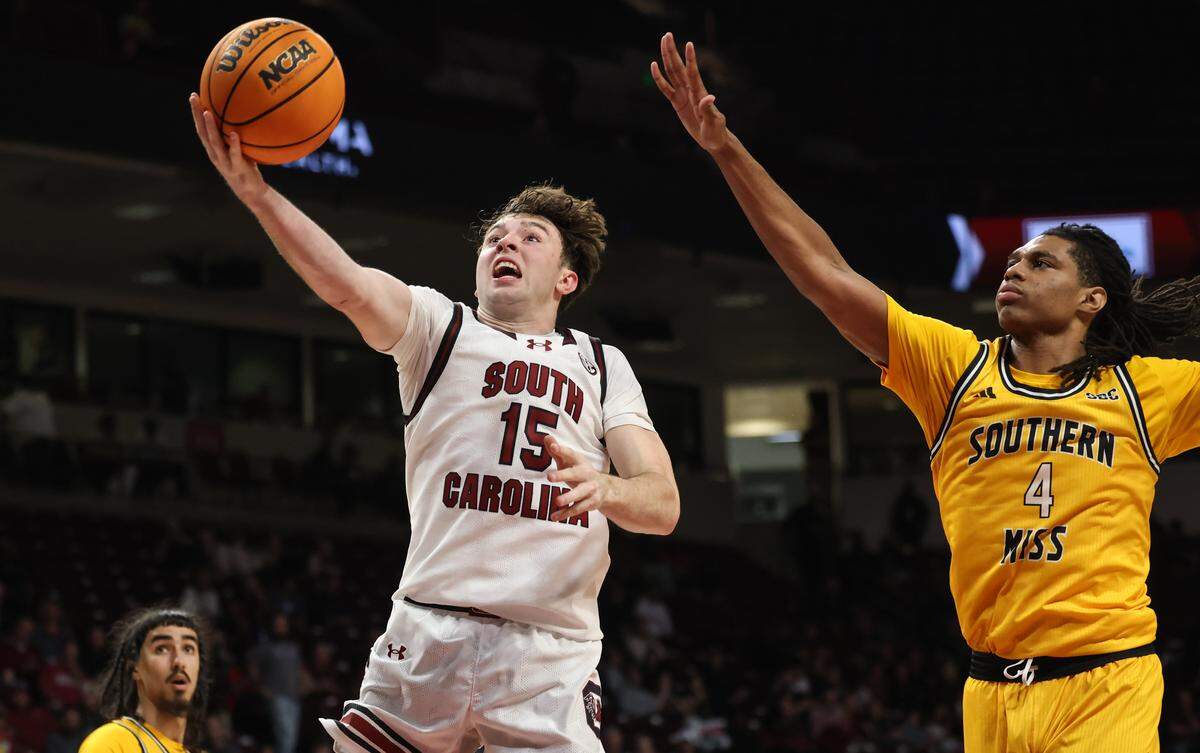 South Carolina guard Eli Ellis (15) puts up a shot as Southern Mississippi forward Tylik Weeks (4) defends during the men's basketball game against Southern Mississippi at Colonial Life Arena on Sunday, Nov. 9, 2025.