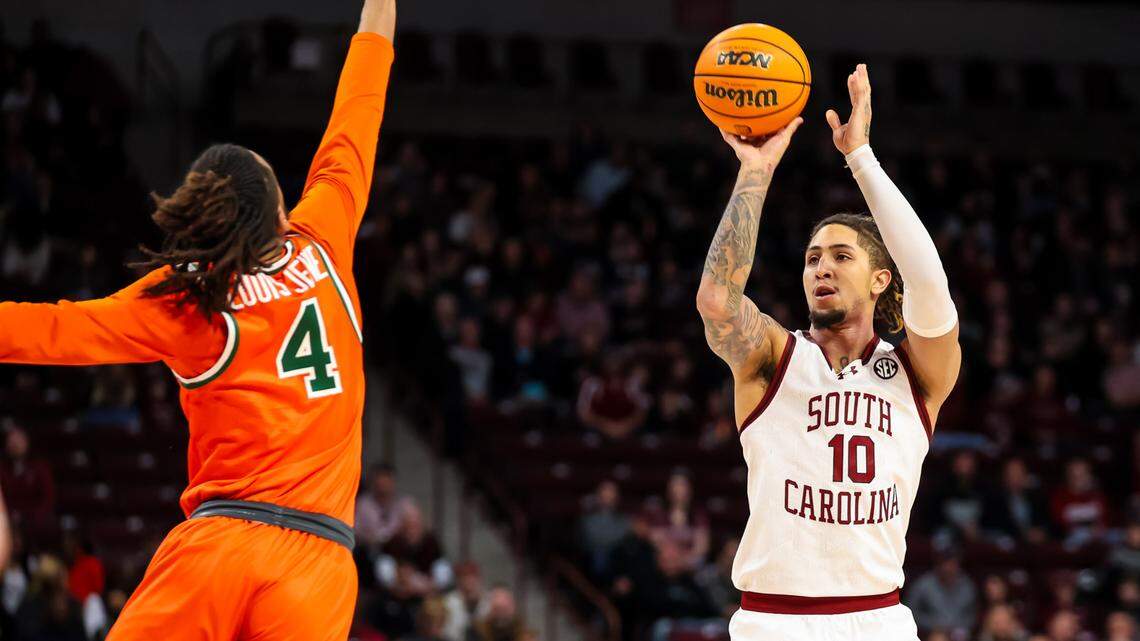 South Carolina Gamecocks guard Myles Stute (10) shoots over Florida A&M Rattlers guard Hantz Louis-Jeune (4) in the first quarter at Colonial Life Arena.