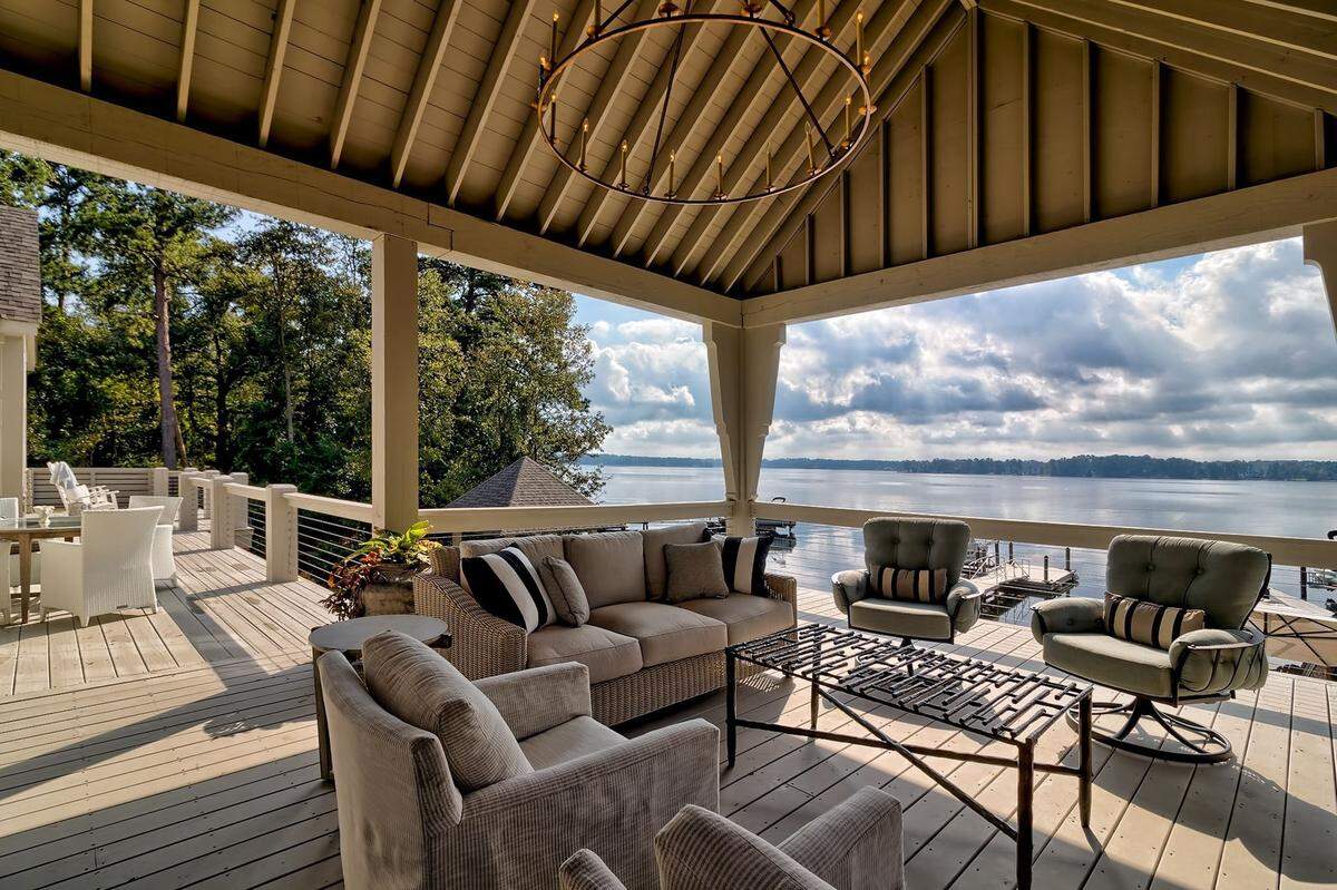 A view of Lake Murray and a dock from a covered porch of a $3.9 million home for sale.