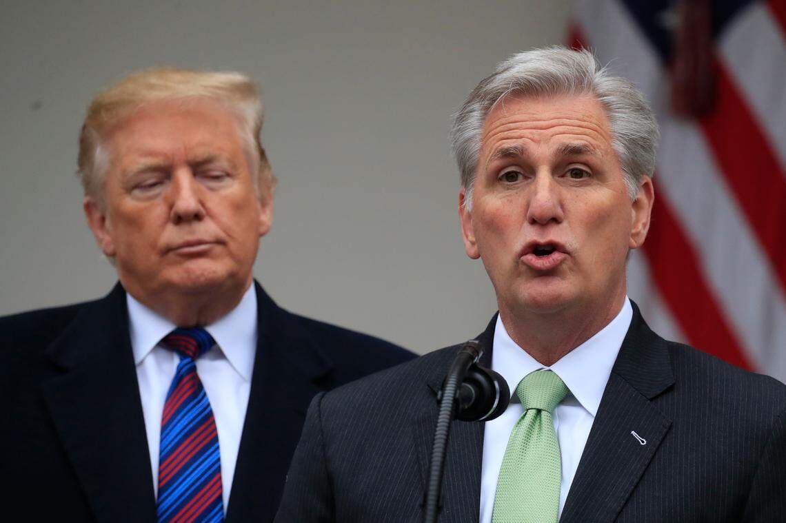 In this 2019 file photo, then-President Donald Trump listens to House Minority Leader Kevin McCarthy of Calif., speaking in the Rose Garden of the White House in Washington, after a meeting with Congressional leaders.