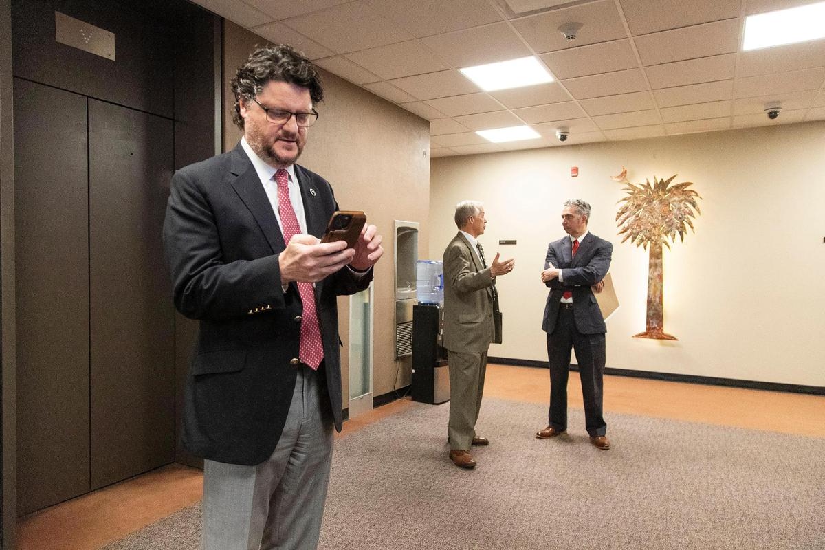 Gary Simrill, R-York, sends text messages relating to a development project in Rock Hill, South Carolina on Tuesday, March 8, 2022. He has represented Rock Hill’s district since 1992.