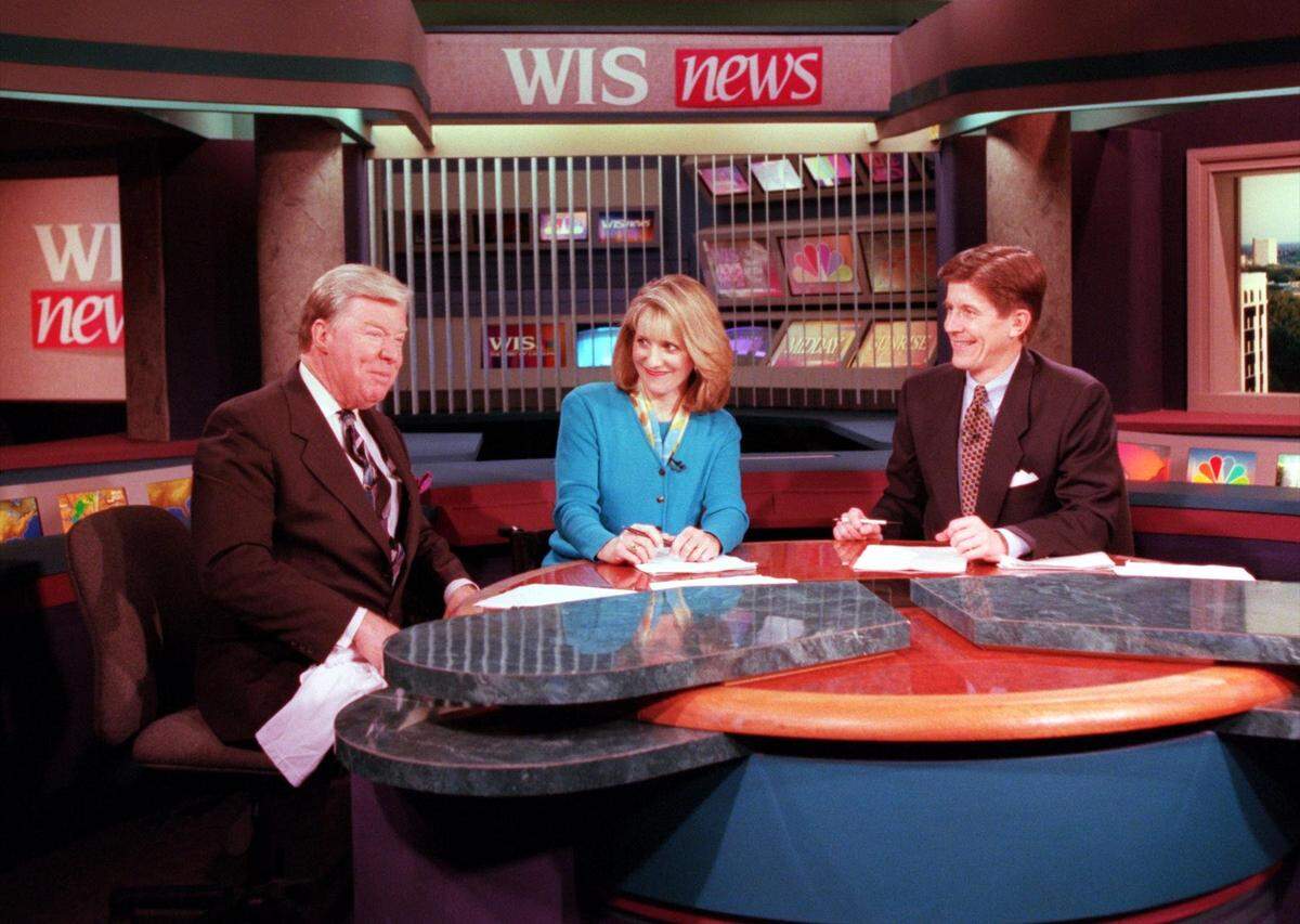 Joe Pinner, left, with Susan Aude Fisher, center, and David Stanton on the set of WIS TV’s “The 7 o’clock Report” in 1998. Aude Fisher was celebrating her 20th anniversary at the station in May 1998. Pinner passed away on the weekend of Sept. 22, 2024.