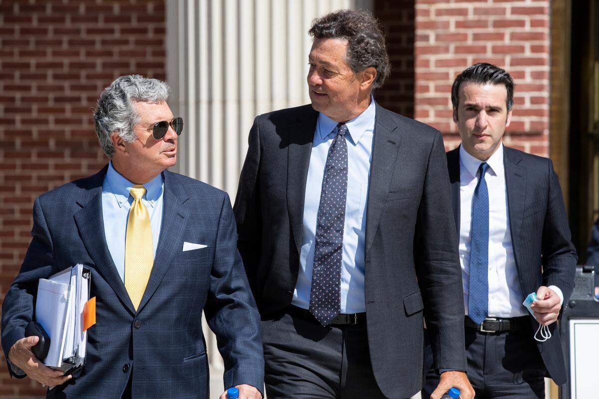 Attorney William Sullivan, left, will be able to stay on as the lawyer for Jeffrey Benjamin, center, the final defendant in the federal SCANA nuclear fraud case
