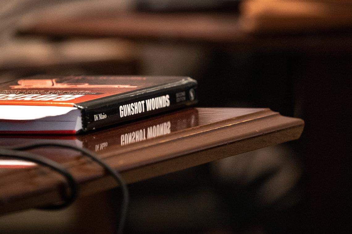 A text book for gunshot wounds is seen on the defense table during the Alex Murdaugh double murder trial at the Colleton County Courthouse in Walterboro on Day 25 of Monday, Feb. 27, 2023. Andrew J. Whitaker/The Post and Courier/Pool