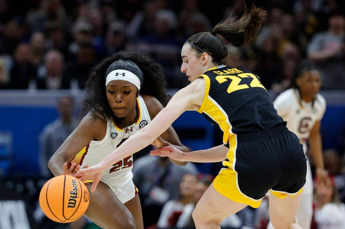 South Carolina’s Raven Johnson (25) swipes the ball from Iowa’s Caitlin Clark (22) during the National Championship game at the Rocket Mortgage FieldHouse in Cleveland, Ohio on Sunday April 7, 2024.