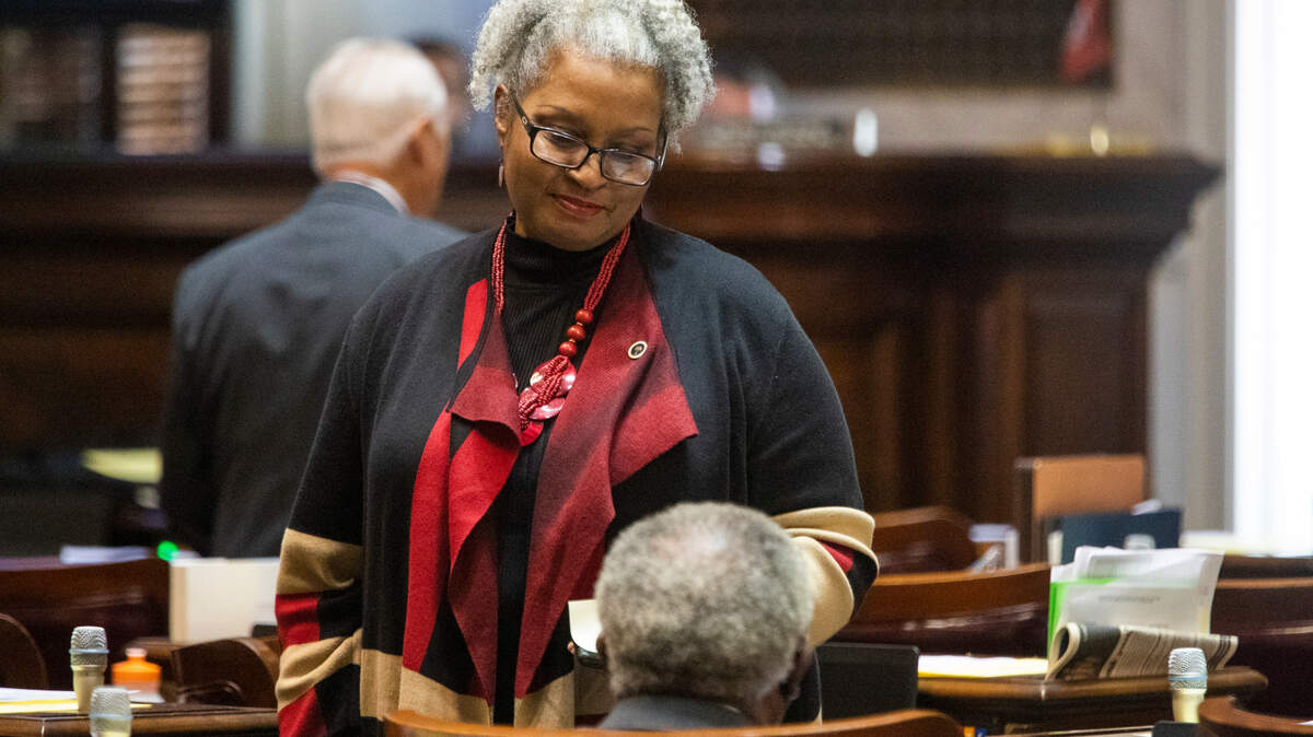 Representative Wendy Brawley speaks with colleagues before session at the South Carolina Statehouse on Wednesday, December 1, 2021.