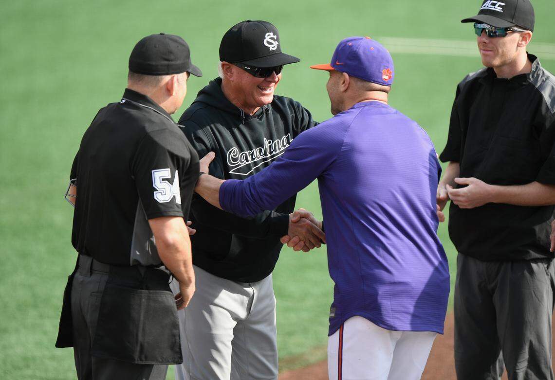 South Carolina baseball coach Paul Mainieri (left) and Clemson baseball coach Erik Bakich (right) shake hands before Sunday’s game at Doug Kingsmore Stadium