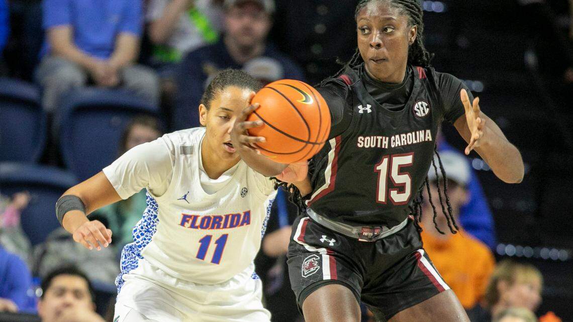 Florida forward Emanuely de Oliveira (11) tries for the ball against South Carolina forward Laeticia Amihere (15) during the first half of an NCAA college basketball game Sunday, Jan. 30, 2022, in Gainesville, Fla. (AP Photo/Alan Youngblood)