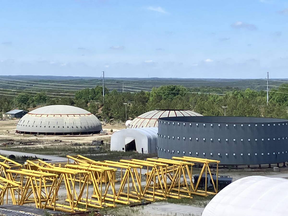 The dome for a nuclear reactor building sits near a collapsed yellow crane at the V.C. Summer nuclear site in Fairfield County, SC, on May 19, 2026. The equipment has been sitting there since the partially built project was scrapped in 2017