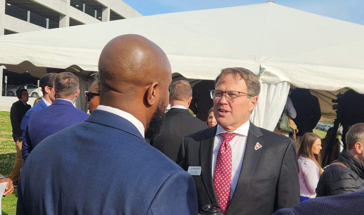 AMAROK CEO Mark Wesley, right, chats with Columbia City Councilman Tyler Bailey on March 24, 2026 as the company announced it would construct a new headquarters at BullStreet.