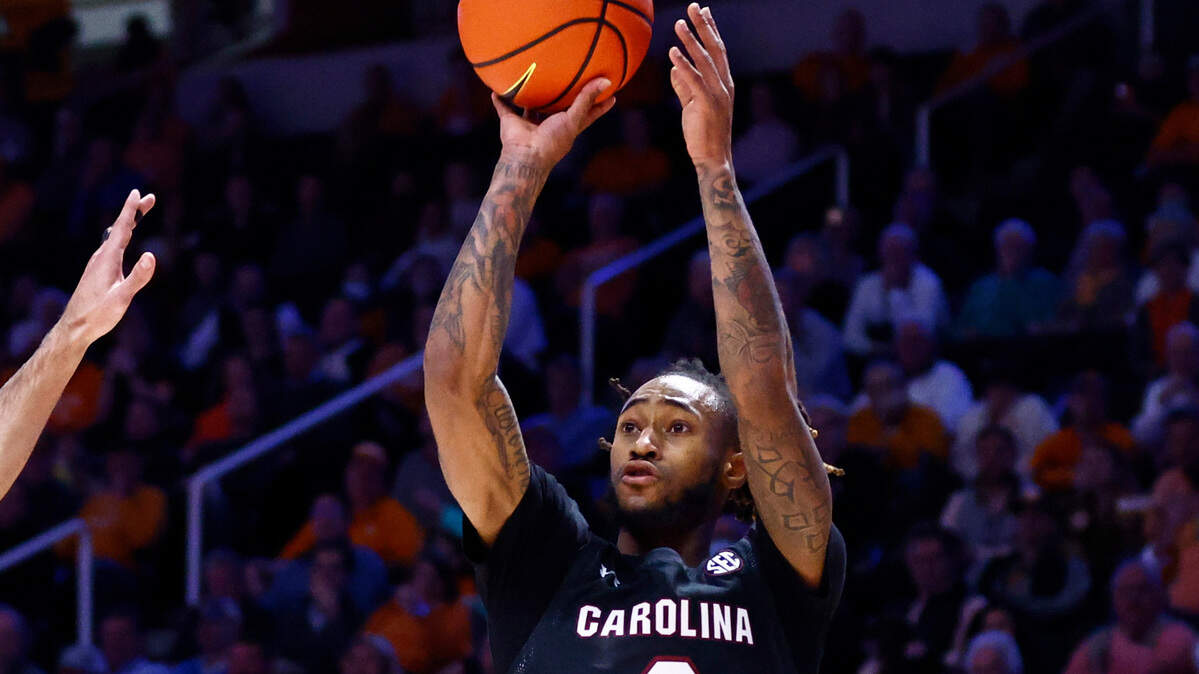 South Carolina guard James Reese V (0) shoot over Tennessee guard Santiago Vescovi (25) during an NCAA college basketball game Tuesday, Jan. 11, 2022, in Knoxville, Tenn. (AP Photo/Wade Payne)