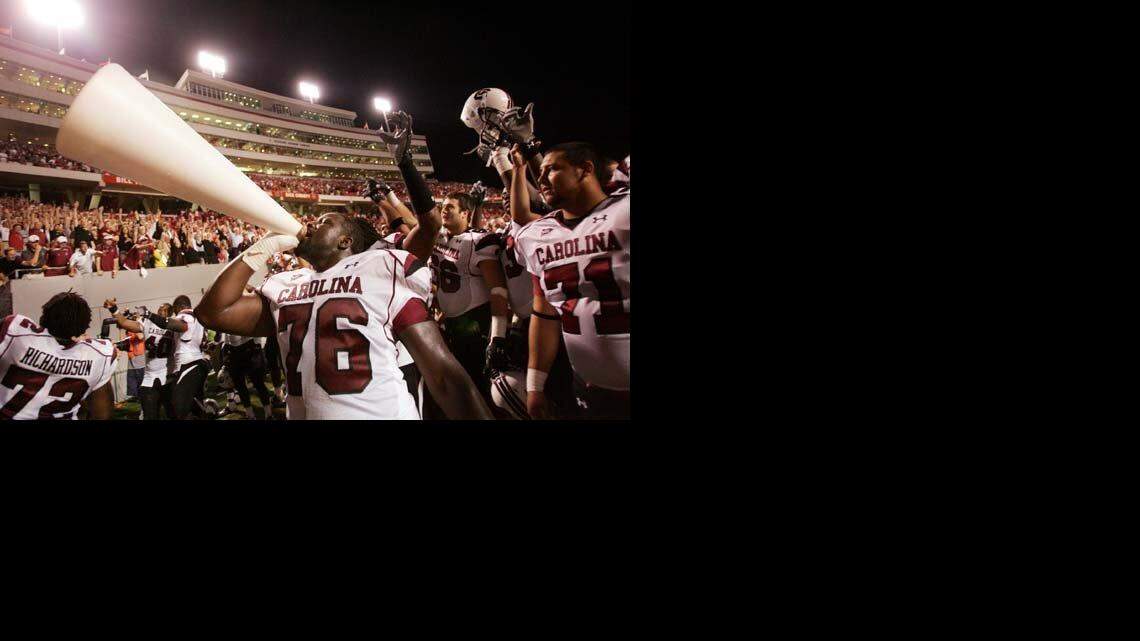 South Carolina offensive tackle No. 76 Jarriel King celebrates the Gamecocks' win over the Wolfpack.