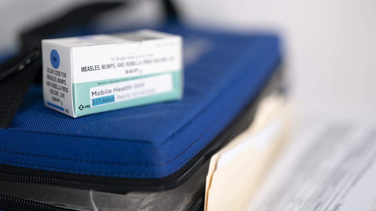 SPARTANBURG, SOUTH CAROLINA - FEBRUARY 6: A box containing vaccinations for measles, mumps and rubella sits on a cooler at a mobile clinic on February 6, 2026 in Spartanburg, South Carolina. The clinic offered free vaccinations as the South Carolina Department of Health reported 876 cases of measles earlier in the week, with the outbreak centered in Spartanburg County. (Photo by Sean Rayford/Getty Images)