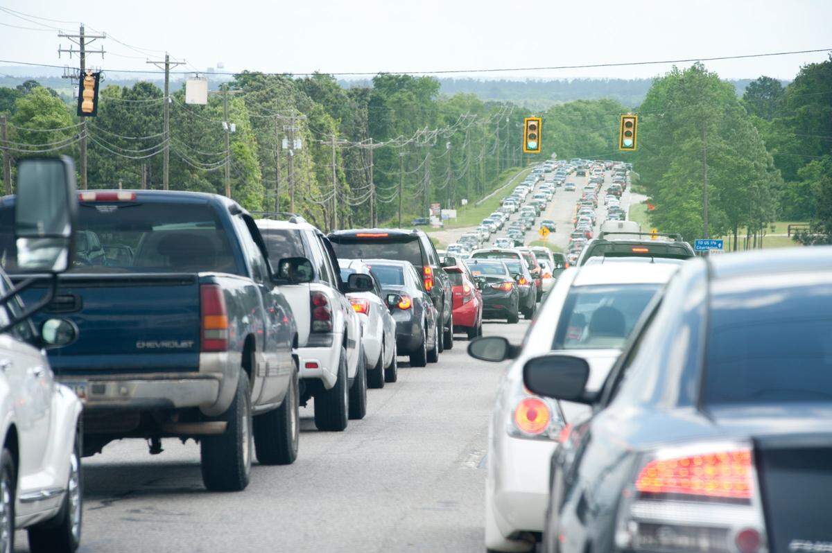Traffic was backed up in both directions along Charleston highway as thousands of people tried to get to the first annual South Carolina Food Truck Festival & Craft Beer Festival at the South Carolina State Farmers Market on Sunday. Festival organizer Anne-Marie Aigner estimated attendance at 12,000 while admitting it was probably closer to 15,000. Many festival-goers reported standing in individual lines for over an hour.4/26/15