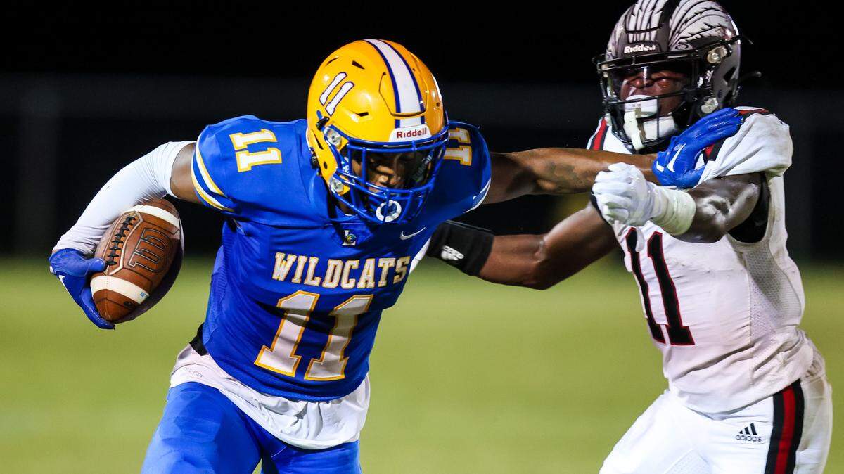 Lexington Wildcats Jarrod Mewborn (11) rushes around Gilbert Indians Chance Jennings (11) during their game at Lexington High School Friday, Sept. 16, 2022.