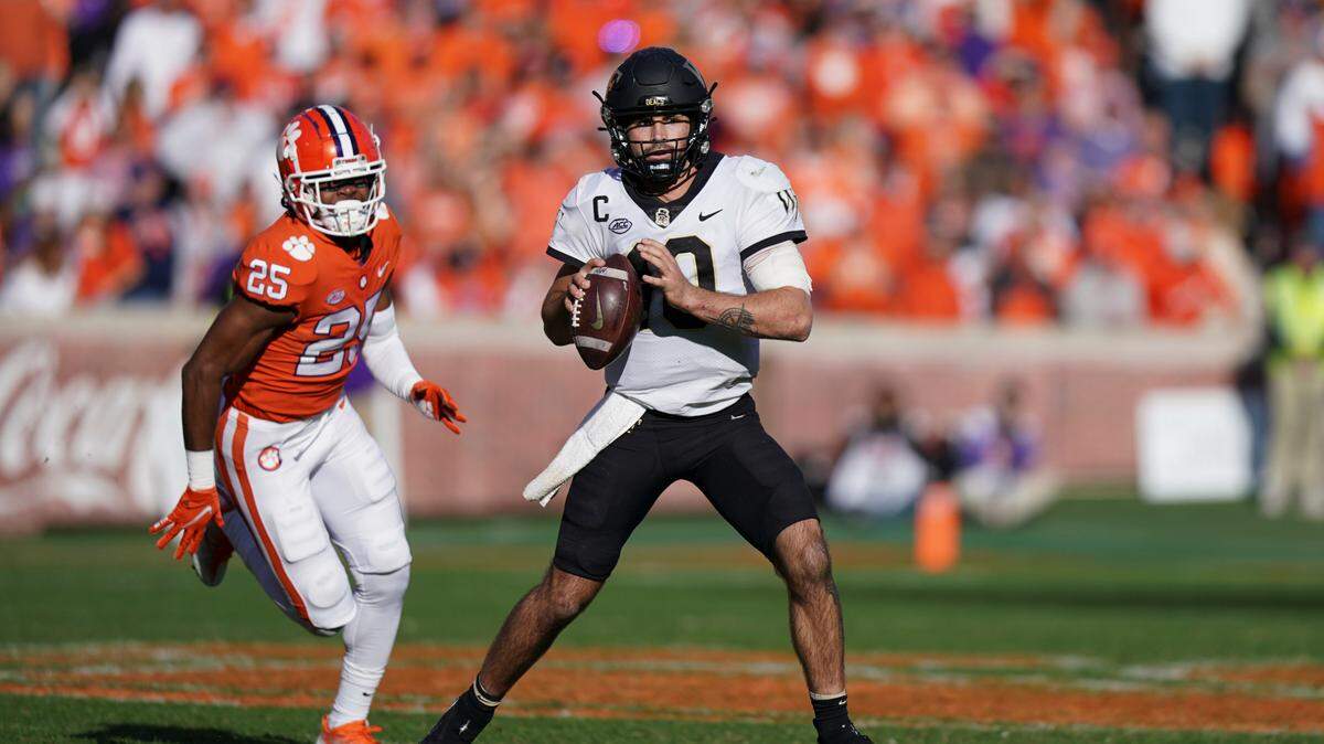 Wake Forest quarterback Sam Hartman (10) sets up to pass the ball against Clemson safety Jalyn Phillips (25) during the second half of an NCAA college football game, Saturday, Nov. 20, 2021, in Clemson, S.C.