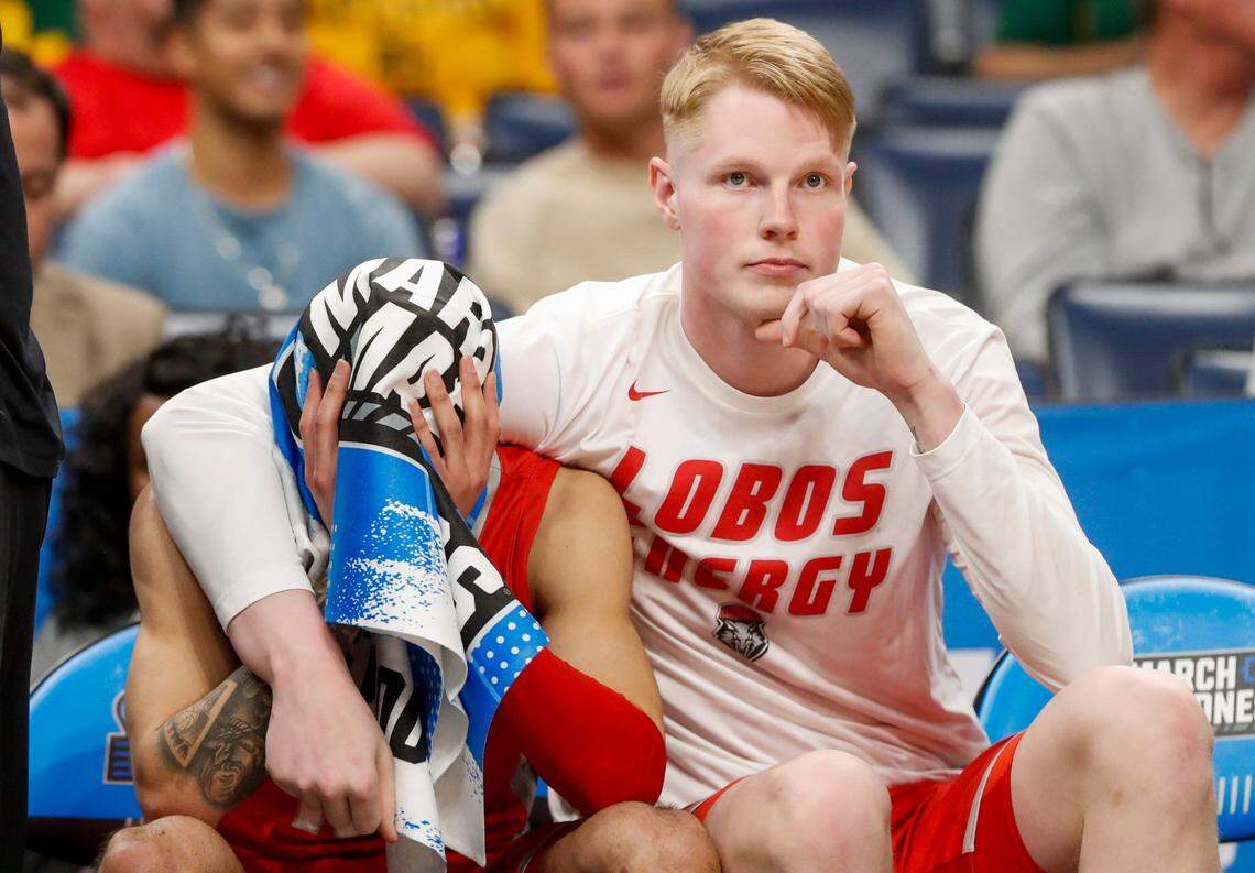 New Mexico’s Jaelen House (10) puts his head in his hands as he is consoled by Sebastian Forsling (21) on the bench during the first round game between Clemson University and University of New Mexico in the 2024 NCAA Tournament at FedExForum in Memphis, Tenn., on Friday, March 22, 2024.