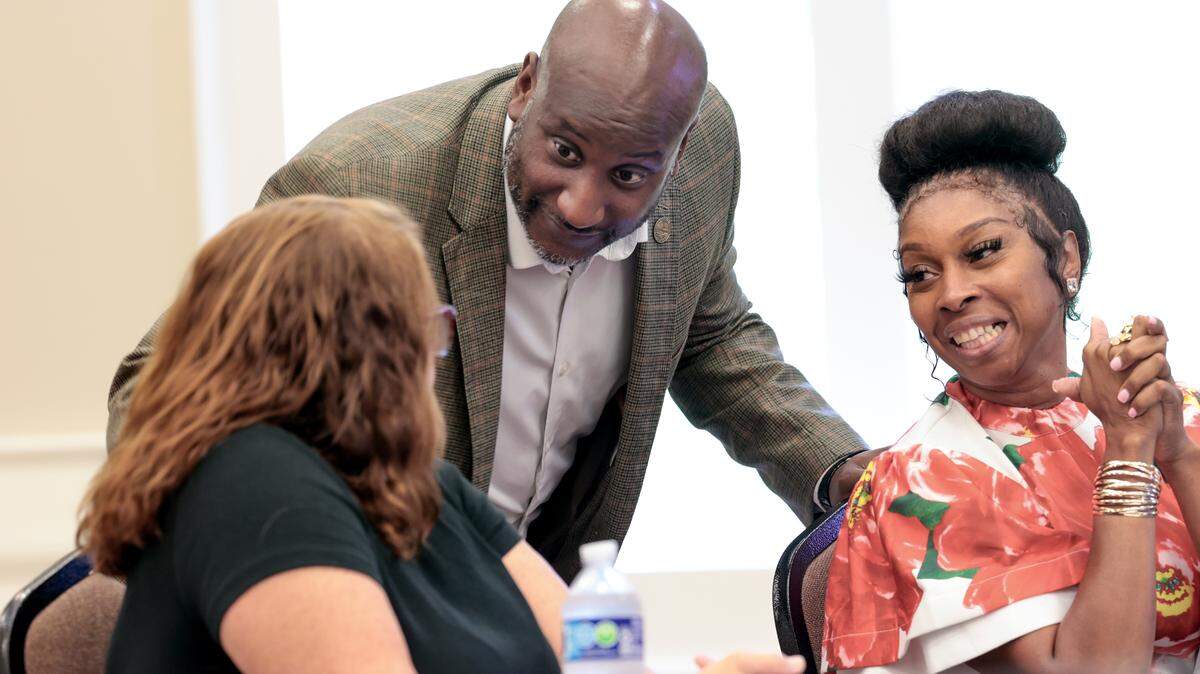 Blythewood Mayor Sloan Griffin, III, speaks to Jennifer Edwards, the human resources and finance director, left, and town clerk Sharon Durst during the Blythewood town council meeting on Monday, August 25, 2025.
