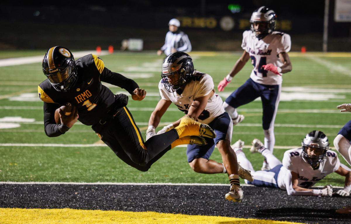 AJ Brand (1) of Irmo dives in for a touchdown during Irmo’s game against White Knoll in their Class 5A Division II semifinal game in Irmo on Friday, December 6, 2024.