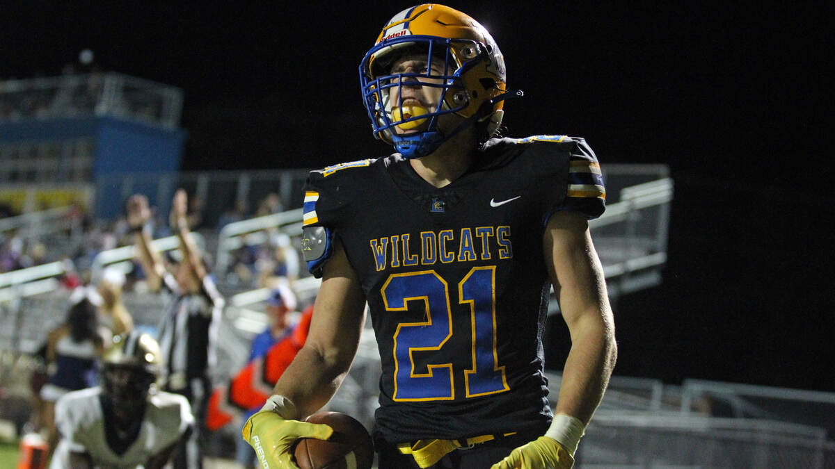 Lexington running back Jonah Norris celebrates a touchdown Friday night in the Wildcats’ win over Blythewood.