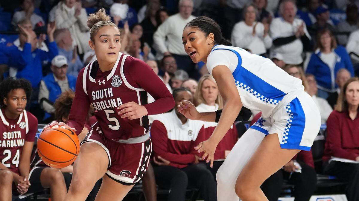 Tessa Johnson #5 of the South Carolina Gamecocks dribbles the ball as she is guarded by Teonni Key #7 of the Kentucky Wildcats in the third quarter at Memorial Coliseum on March 01, 2026 in Lexington, Kentucky.