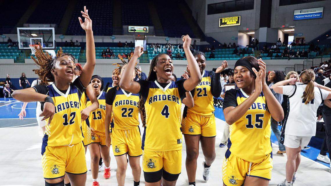 The Keenan High girls celebrate Saturday’s Class 3A Lower State championship win over Oceanside Collegiate at the Florence Center.
