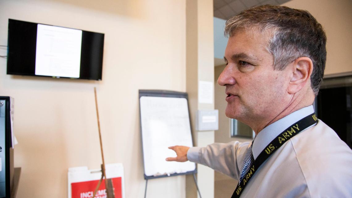 Transitions Homeless Center CEO Craig Currey points to a modified meal schedule at the center on Tuesday, March 17, 2020. In order to prevent large crowds that may lead to community transmission of the coronavirus, meals will happen in smaller shifts.