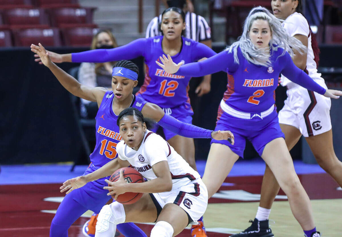 South Carolina Gamecocks guard Zia Cooke (1) is pressured by Florida guard Nina Rickards (15), forward Emily Sullivan (2) and forward Jordyn Merritt (12) during the second half of action against Florida in the Colonial Life Arena.