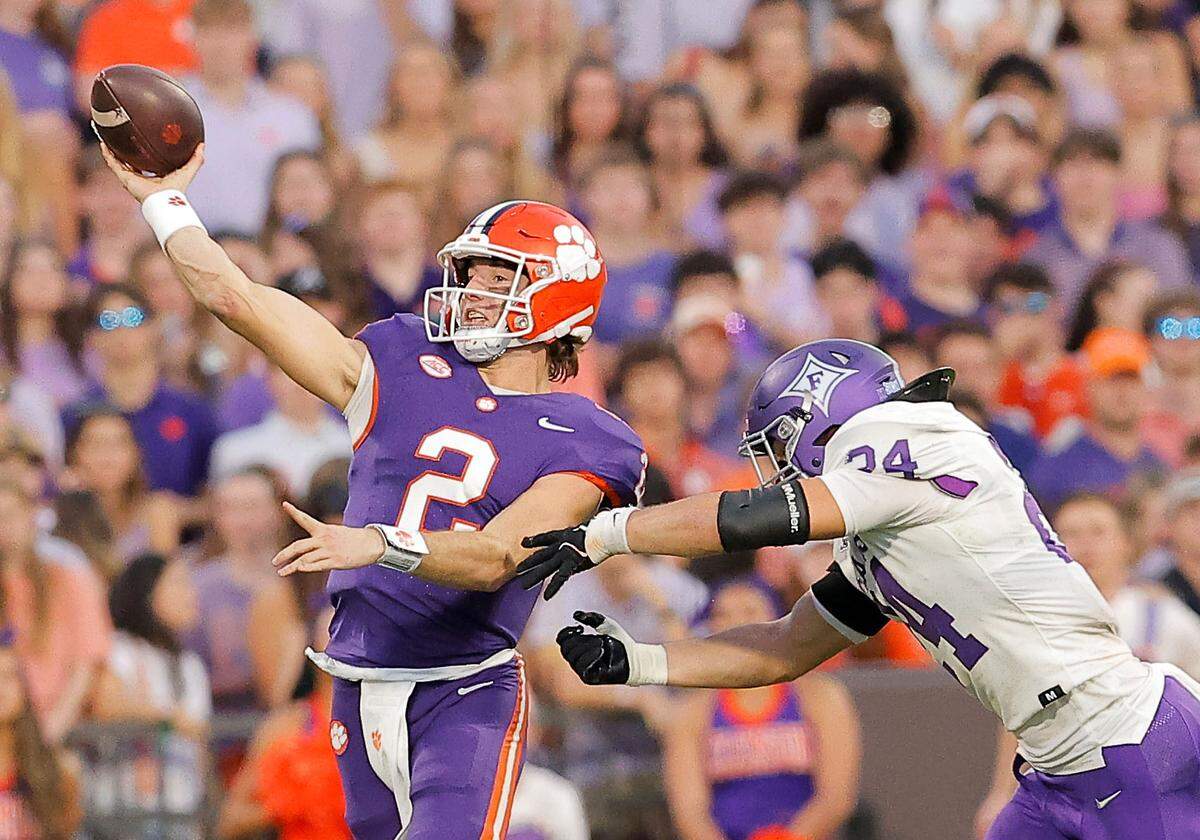 Clemson quarterback Cade Klubnik (2) unloads a pass in front of Furman linebacker Raleigh Herbert (24) during first-half action in Clemson, S.C. on Saturday, Nov. 22, 2025.